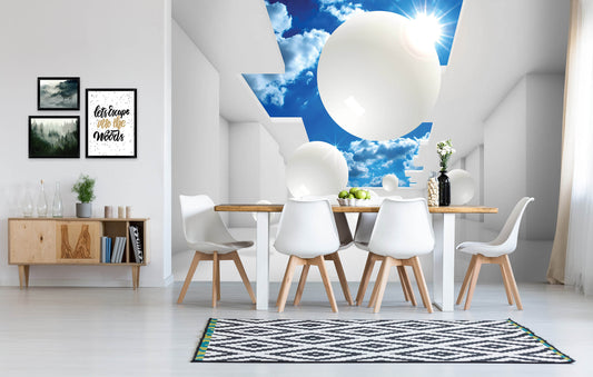 A photo wallpaper featuring a 3D abstract composition of spheres in various sizes, installed on a wall above a dining area with white chairs and a wooden table.