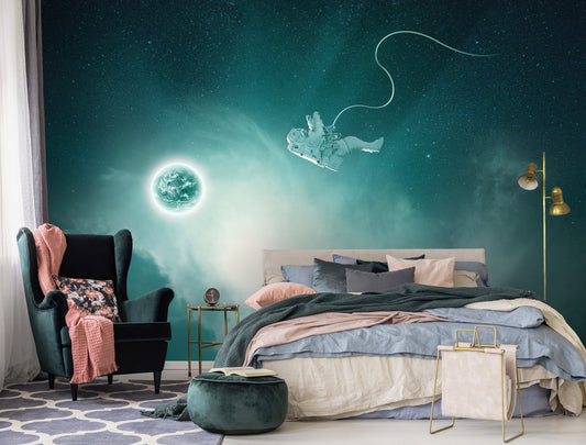 A bedroom with a wall adorned with non-woven photo wallpaper featuring a cosmic space theme, including images of stars, planets, and a comet.