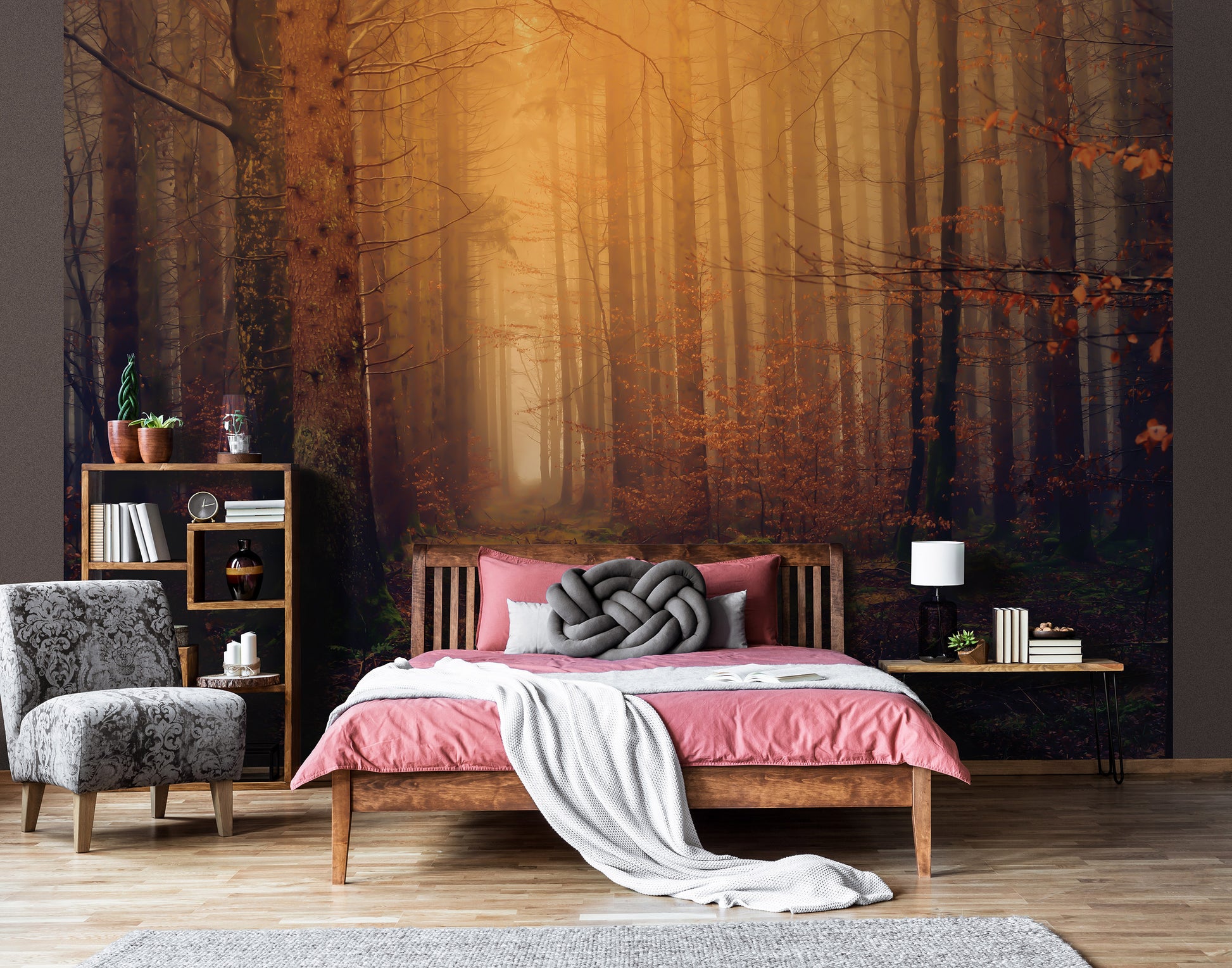 Room interior with a bed, armchair, and bookshelf against a forest wall mural.