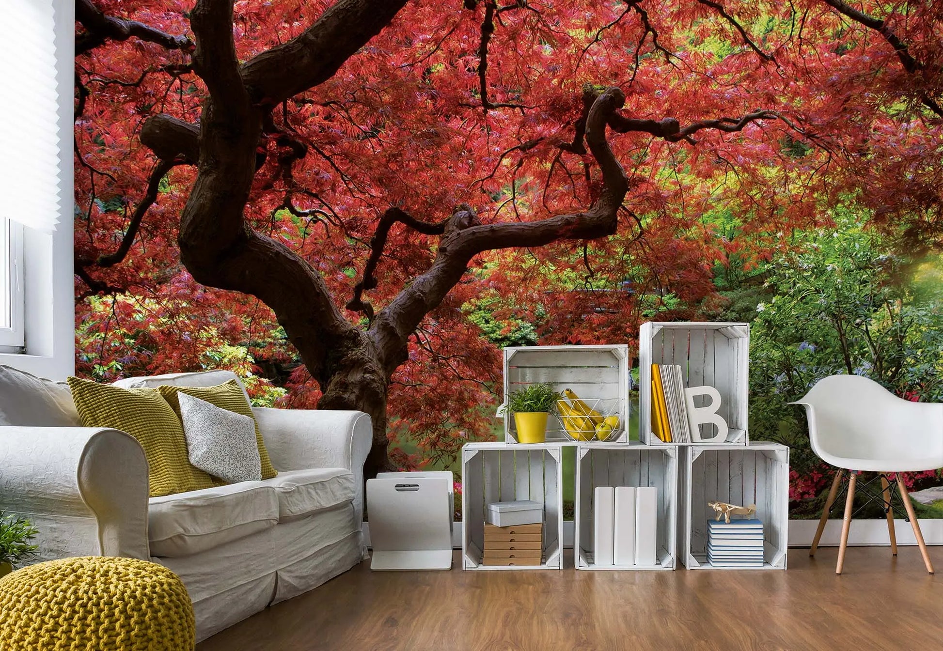 Living room with a large wall mural of a tree with red leaves.