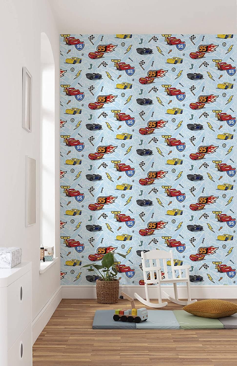 Children's room with colorful car-themed wallpaper