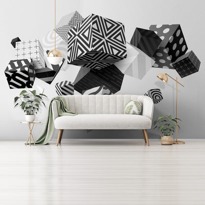 A room with white walls adorned with black and white geometric patterned 3D photo wallpaper, featuring cube-shaped designs and abstract elements.