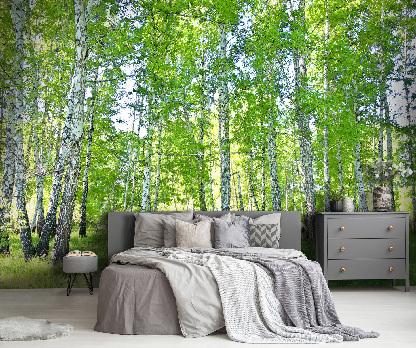 Bedroom with a forest wall mural featuring birch trees.