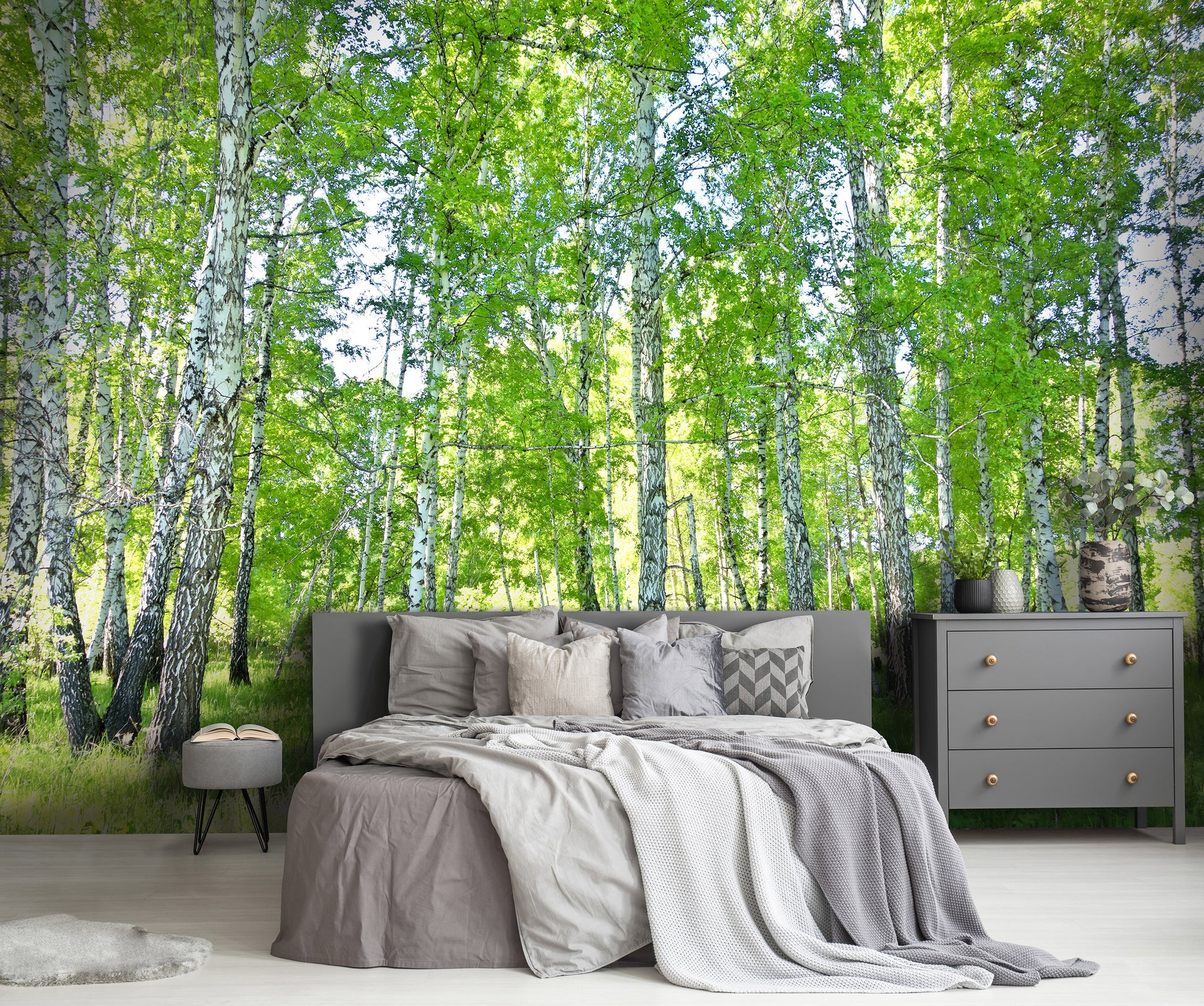 Bedroom with a forest wall mural featuring birch trees.