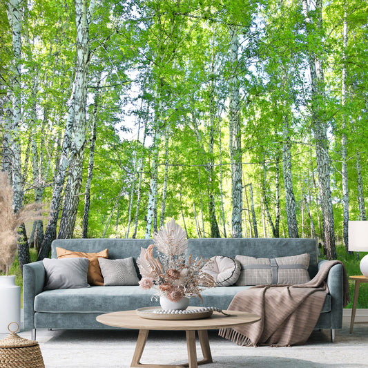 Living room with a large wall mural of a forest
