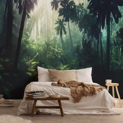 A bedroom with a jungle-themed non-woven photo wallpaper featuring a lush rainforest background. The bed is placed against a wall with a large window, and there is a wooden side table with a cup and a book on the bed.