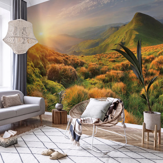 Living room with a large wall mural of a mountain landscape.