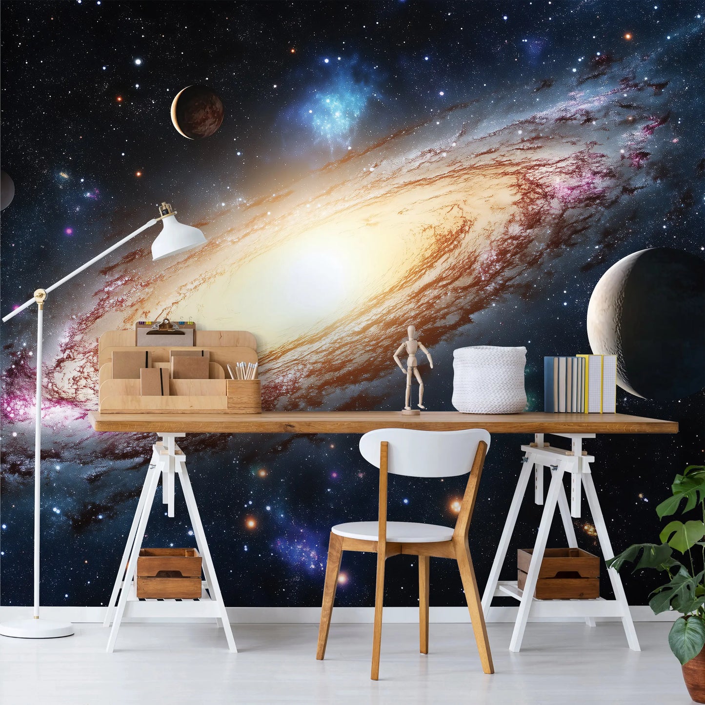 Modern office setup with a desk against a space-themed wall mural.