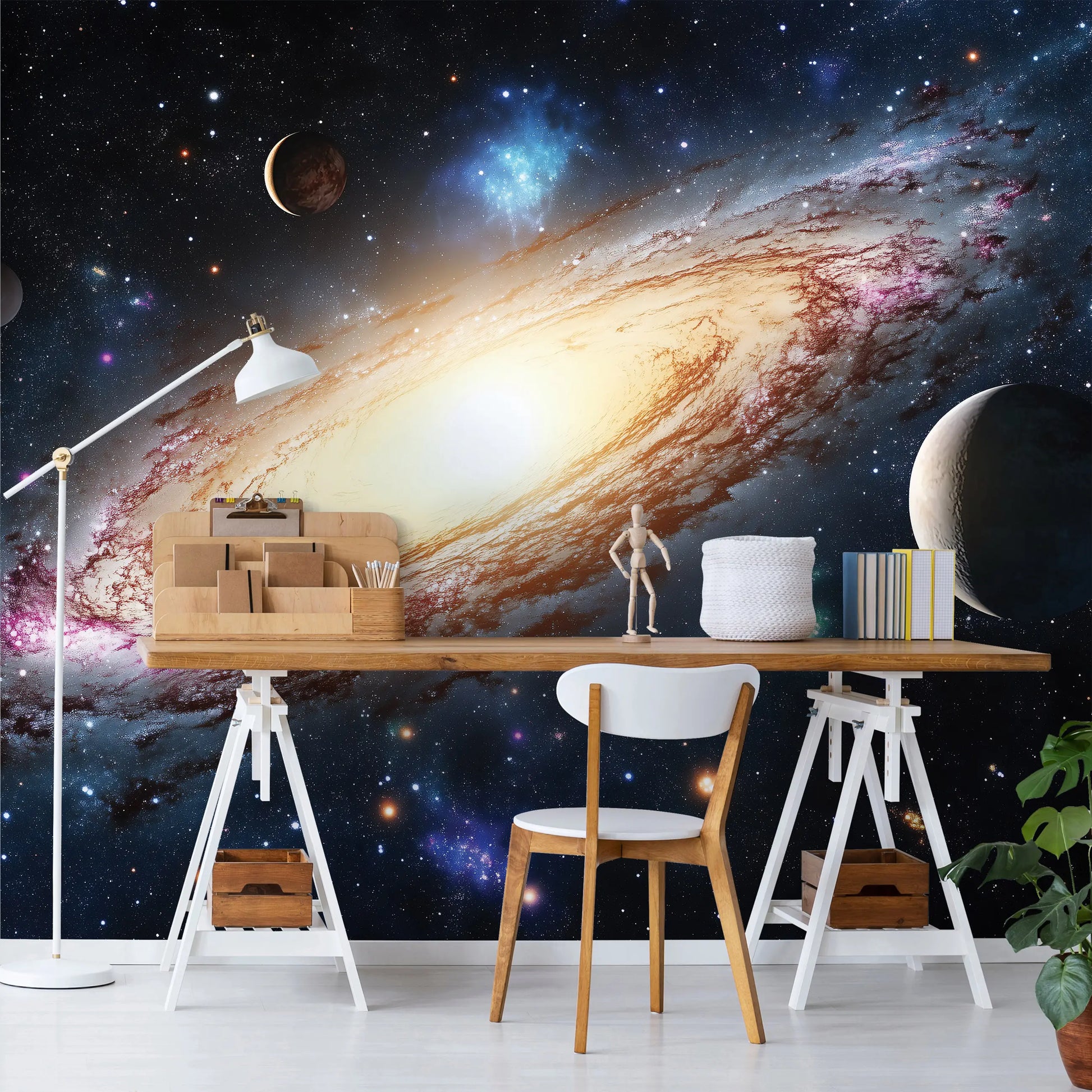 Modern office setup with a desk against a space-themed wall mural.