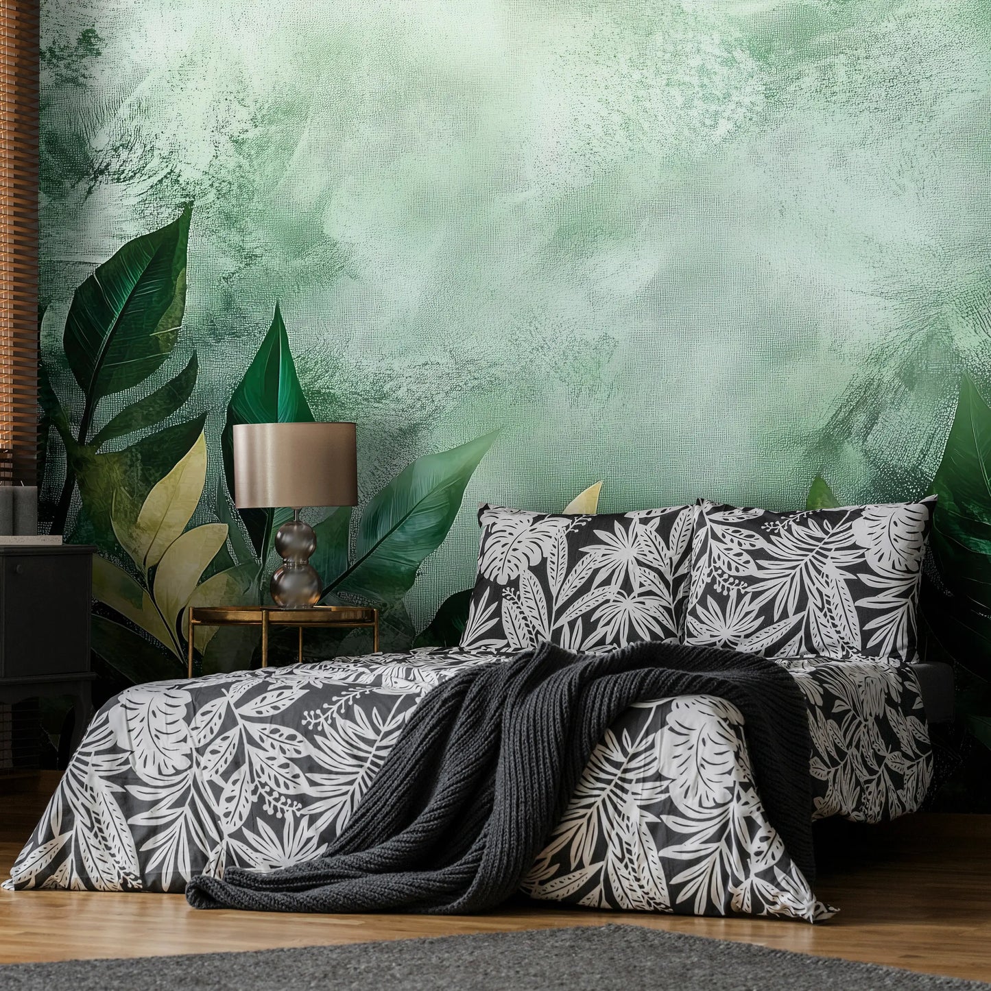 Bedroom with floral bedding and pillows against a green leafy wall.