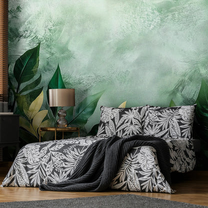Bedroom with floral bedding and pillows against a green leafy wall.