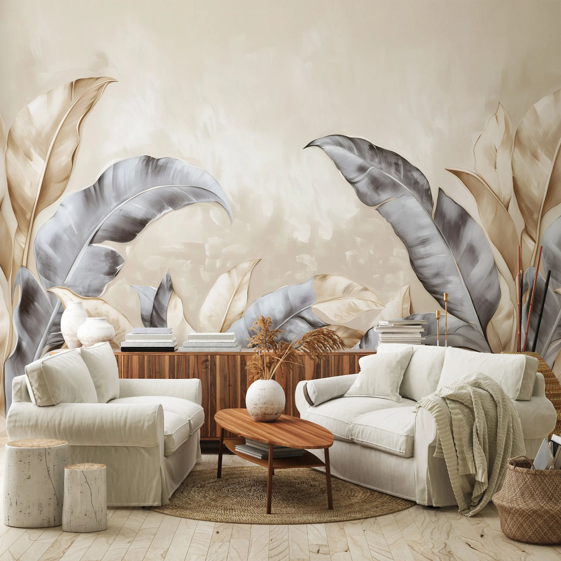 Modern living room with white sofa, armchair, and wooden coffee table against a decorative wall with leaf patterns.