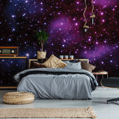 Bedroom with a starry night wall mural