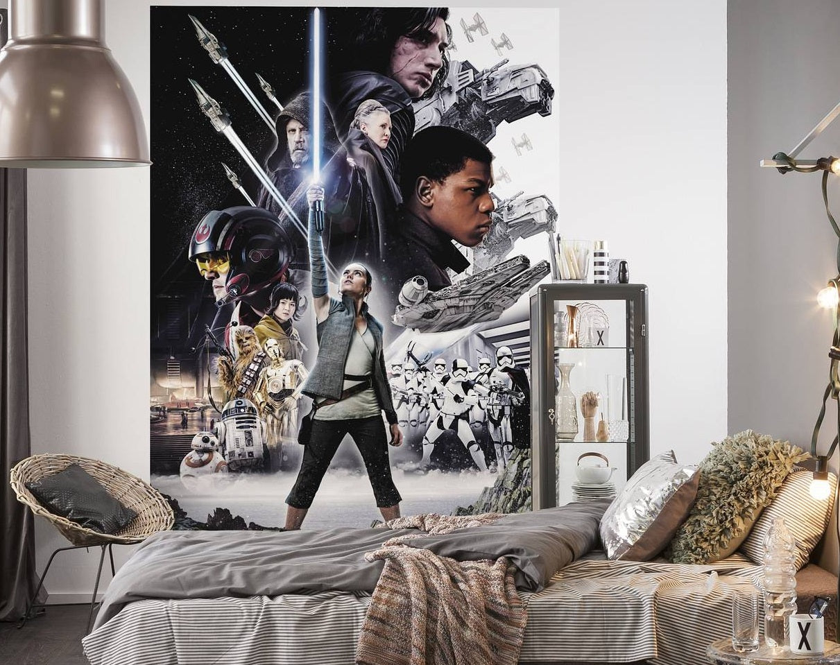 Room interior with a Star Wars-themed wall poster above a bed.