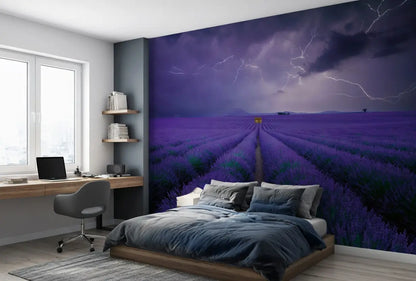 Room interior with a large wall mural of a lavender field and stormy sky.