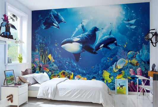 Room interior with a large underwater mural featuring orcas and colorful fish.