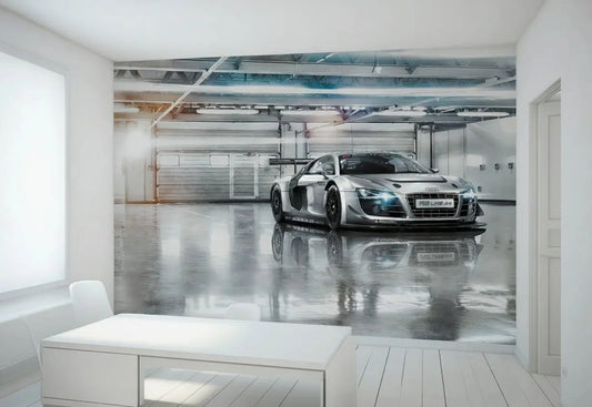 Modern office with a large wall mural of a silver Audi car in a garage.