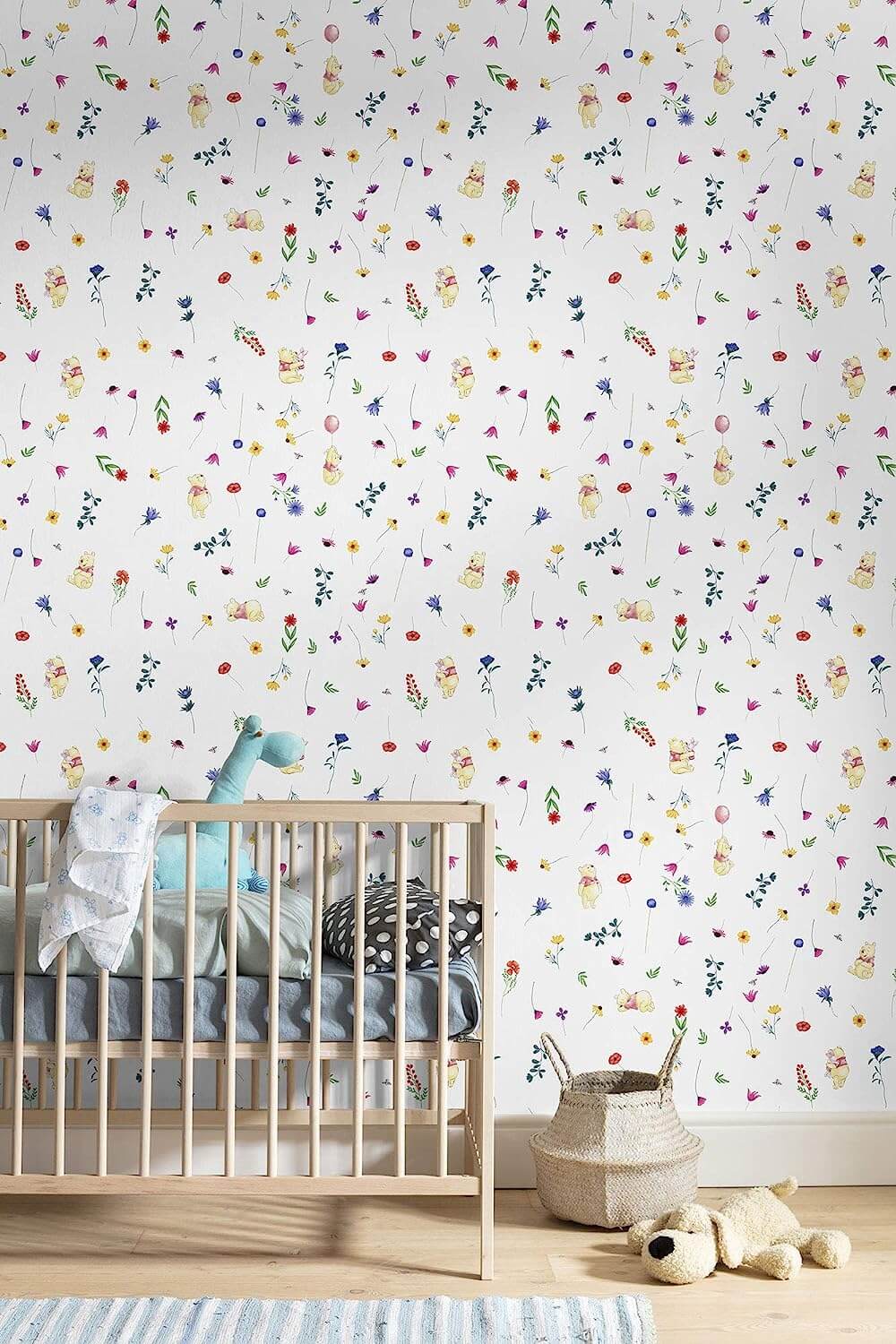 Children's room with crib and colorful patterned wallpaper